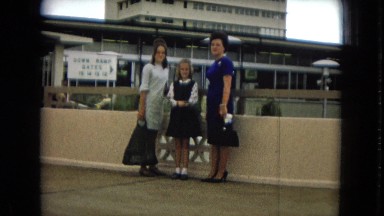 1967: woman and girls posing in front of an airport terminal HAWAII