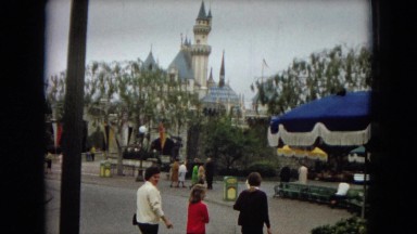 1967: family walking in an amusement park DISNEYLAND, CALIFORNIA