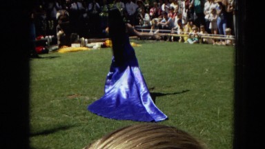 1967: lady in blue dress dancing the hula DISNEYLAND, CALIFORNIA