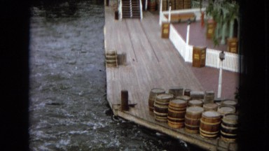 1967: seaside dock storing casks by rough water DISNEYLAND, CALIFORNIA