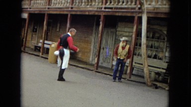 1967: old western bartender approach cowboy DISNEYLAND, CALIFORNIA