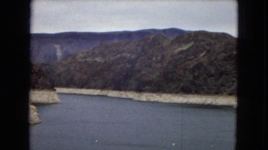 1967: a large body of water surrounded by steep, rugged mountains