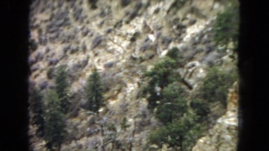 1967: a beautiful rugged mountain and canyon landscape under a cloudy sky