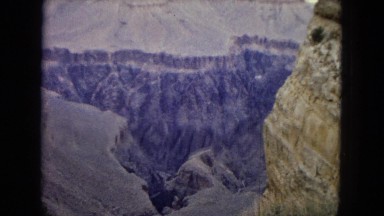1967: beautiful view of a canyon from the distance on top of a high cliff