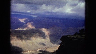 1967: a beautiful rugged mountain and canyon landscape under a cloudy sky