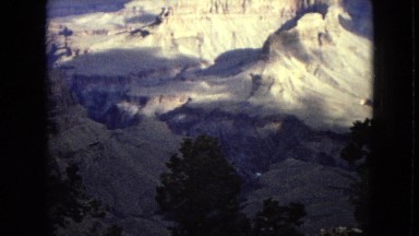 1967: a beautiful rugged mountain and canyon landscape under a cloudy sky