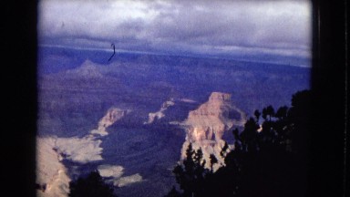 1967: peaks and valleys of grand canyon scenery foreground clouds background