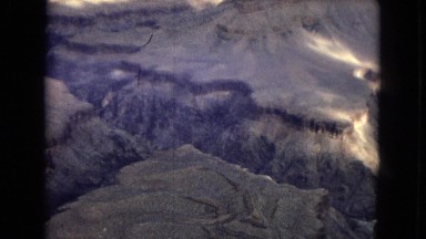 1967: beautiful view of a vast canyon under a dark and cloudy sky ARIZONA