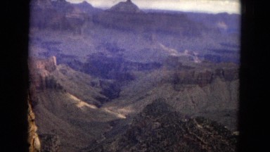 1967: a beautiful desert and rugged mountain ridgeline with a bright blue sky