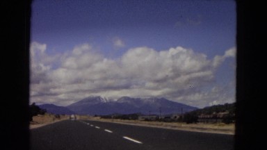 1967: car on a highway passing by other cars on a sunny day ARIZONA