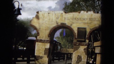 1967: a train on a track passing by a broken arch CALIFORNIA