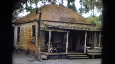 1967: an old, run-down, wooden house on an empty lot CALIFORNIA
