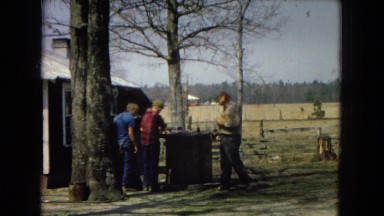 1967: father walking away from sons at the farm ARIZONA