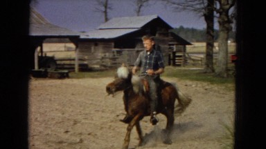 1967: a handsome young man riding a small horse or pony ARIZONA