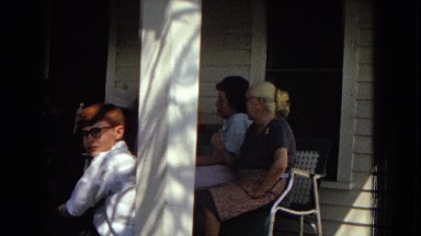 1967: a group of people sitting on the front porch of a white house. ARIZONA