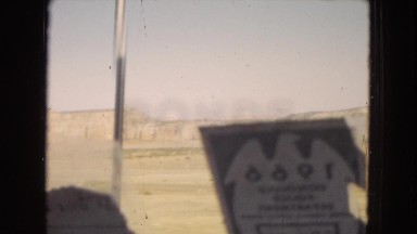 1967: driving in a sunny and large desert on a straight road ARIZONA