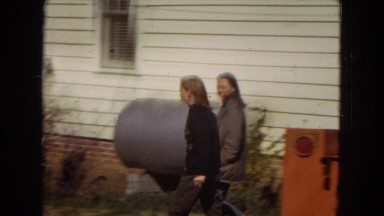 1967: woman walking around yard ARIZONA