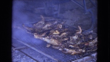 1967: a massive outdoor grill with meat cooking over an open fire ARIZONA