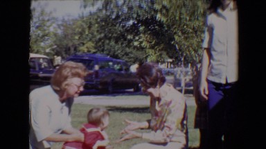 1967: grandmother visiting her daughter and playing with her granddaughter