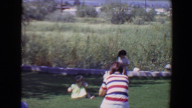 1967: family members enjoying a sunny day outdoor on the grass TUCSON, ARIZONA