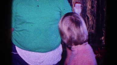 1968: two kids talking in front of mantle at christmastime MINNESOTA