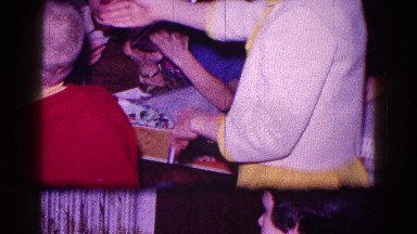 1968: someone passing out christmas gifts to children