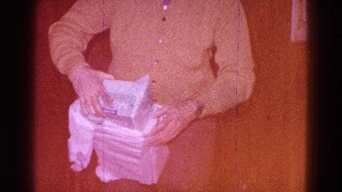 1968: christmas scene mother cheered indoor party, presents
