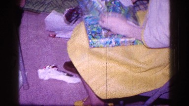 1968: children sitting on the floor and unwrapping the presents MINNESOTA