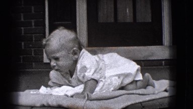 1941: Toddler Crawling and Resting on Grass in New York