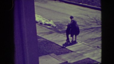 1945: a woman trying to teach a little boy how skating on the street NEW YORK