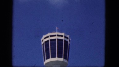1964: View of an Observatory Tower Against a Bright Blue Sky Featuring a Flag