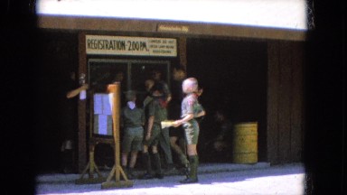 1965: scouts in uniform holding papers stand in front of a counter CALIFORNIA