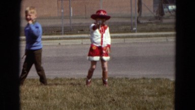 1967: a little girl dressed as a cowboy, shooting a toy pistol. DETROIT LAKES