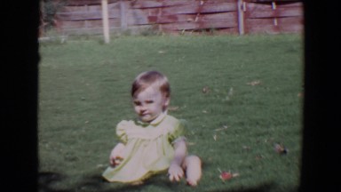 1967: joyous backyard fun in the sun with an infant who discovers a stick