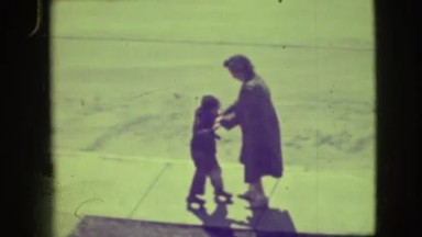 1945: Mother Training Her Child to Skate on the Ground in New York