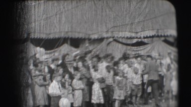 1948: various people and animals performing stunts near a tent at a circus