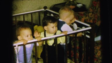 1964: Three Adorable Toddler Boys Standing Inside a Playpen in Camden, New Jersey
