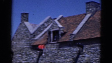 1964: a large old building made of stone receiving many visitors CHARLESTON