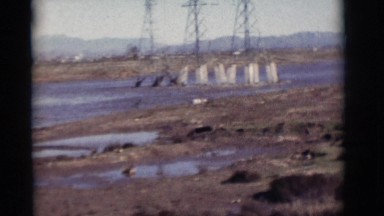 1964: dried up lake, highway, and billboard NEW MEXICO