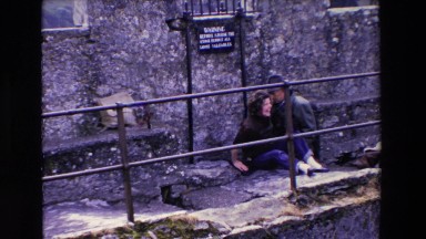 1969: an old man attending a funny lady lying on the ground IRELAND