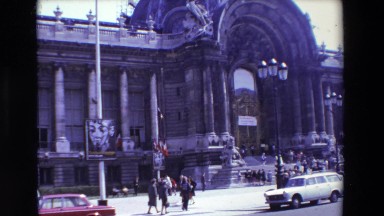 1969: french flag flying over historic building PARIS, FRANCE