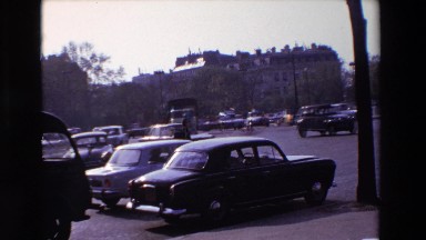 1969: many vehicles are running on the road in a busy city PARIS, FRANCE