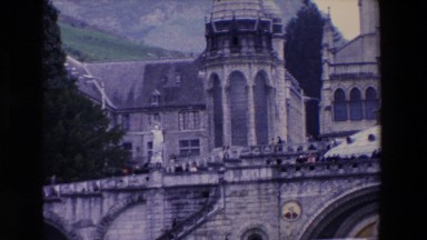 1969: a huge old stone church with mountains in the background view. PARIS
