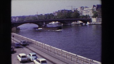 1969: bridge with traffic and riverboat PARIS, FRANCE