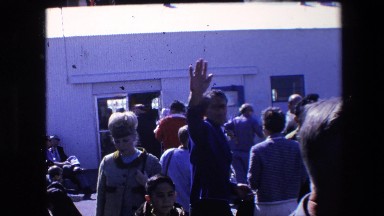 1967: People Enter and Exit a Building at an Airport