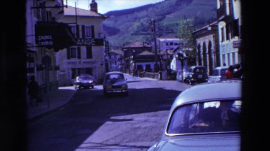 1969: Cars Passing By Waving on Huge Road in Lourdes, France