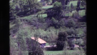 1969: Picturesque View of a Valley Filled with Farms, Buildings, and Trees