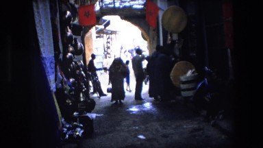 1971: Shoppers in Middle Eastern Market Wearing Burkas and Carrying Baskets