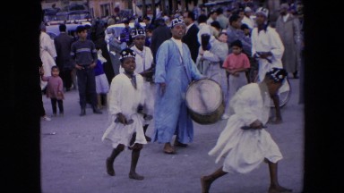 1971: african dancers move in unison in a circular pattern