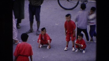 1971: a young male street performer does serial backflips on command ALGERIA